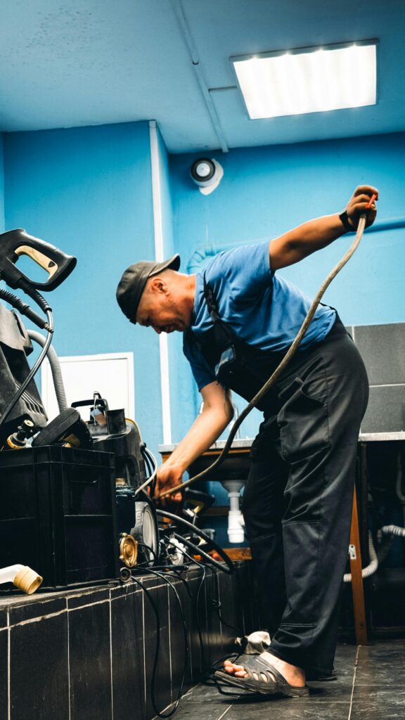 Real photo of a handyman fixing something in a Dubai apartment