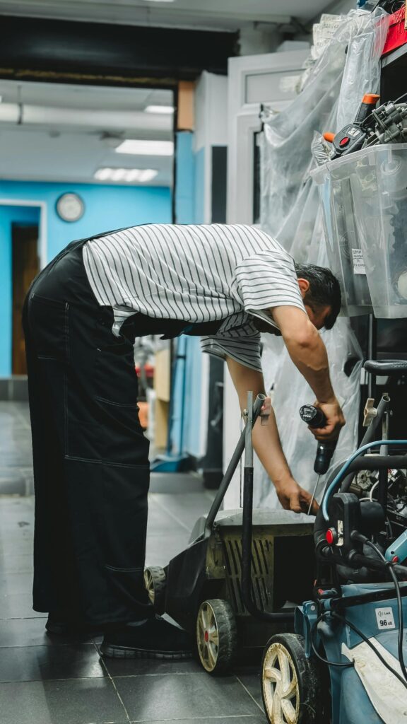 Real photo of a handyman fixing something in a Dubai apartment
